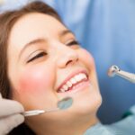 Woman smiling during dental exam