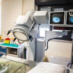 C-arm fluoroscopy machine in procedure room